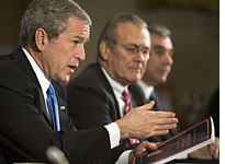 George Bush and Donald Rumsfeld. Click image to expand.