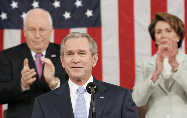 President George W. Bush is backed by Vice President Dick Cheney, left, and Speaker of the House Nancy Pelosi.