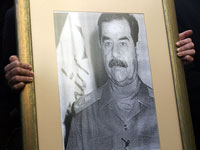 A portrait of Saddam Hussein. Click image to expand.