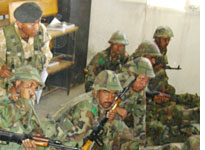 Recruits at Kabul's Afghan National Army Training Center learn how to load and aim rifles. Click image to expand.