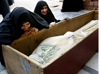 Iraqi mourners. Click image to expand.