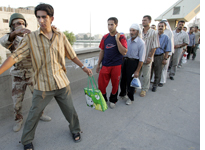 Waiting in line at the Green Zone in Baghdad. Click image to expand.