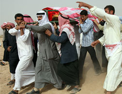 Syrians carry the coffin of a realtive killed in a U.S. attack. Click image to expand.