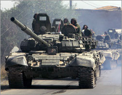 Russian tanks roll on a street in Tskhinvali. Click image to expand.