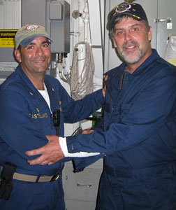 Maersk-Alabama Capt. Richard Phillips (right) stands alongside Cmdr. Frank Castellano. Click image to expand.