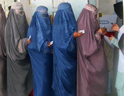 Afghan women learn how to vote. Click image to expand.
