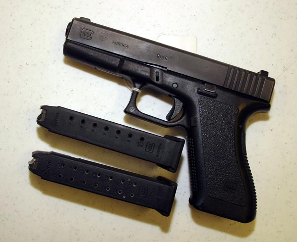 Glock 9mm pistol with two clips.