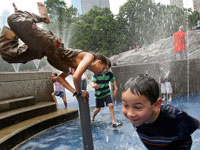 Children playing in a Central Park fountain.