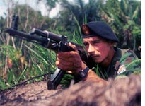 A guerrilla from the Revolutionary Armed Forces of Colombia (FARC). Click image to expand.
