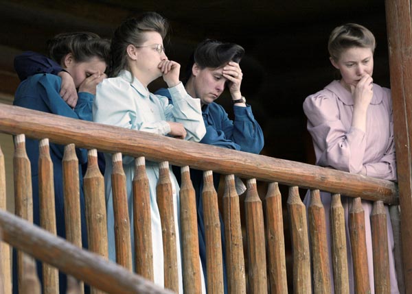 Members of the Fundamentalist Church of Jesus Christ of Latter Day Saints look on as others talk to reporters on the premises of the Yearning for Zion ranch in Eldorado, Texas, April 14, 2008. The members told of their 11-day experience in a shelter.