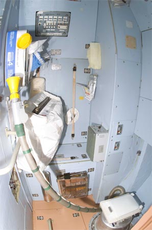 A toilet compartment in the International Space Station.