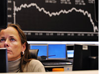 A trader at the stock exchange in Frankfurt. Click image to expand.