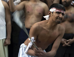Pakistani Shiites flagellate themselves during Ashura. Click image to expand.