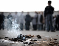 A piece of alleged white phosphorous still burning. Click image to expand.