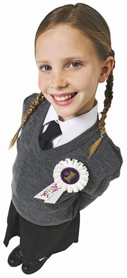 Girl wearing a 1st prize rosette.