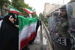 Iranian protesters and Iranian police. Click image to expand.