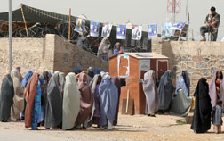 Burqa-clad female supporters of Afghan President Hamid Karzai arrive at an election gathering in Kandahar. Click image to expand.