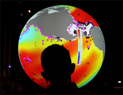 A man watches an animated projection showing the different acidity levels of the oceans, inside the U.S. Center 09 during the second day of the United Nations Climate Change Conference 2009 on Dec. 8, 2009 in Copenhagen, Denmark.