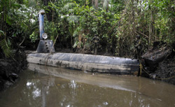 Colombian soldiers guard a homemade submersible in a rural area of Timbiqui, department of Cauca, Colombia. Click image to expand.