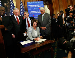 House Speaker Nancy Pelosi signs the HR1424 Financial Rescue package bill. Click image to expand.
