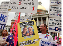 Proponents of gay marriage hold signs. Click image to expand.