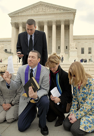 Rev. Rob Schenck of the National Clergy Council and pro-life advocates pray on the steps of the Supreme Court.