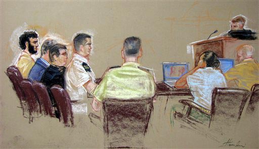 Guantanamo detainee Omar Khadr, far left.