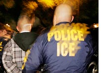 An ICE officer arrests a suspect. Click image to expand. 