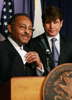 Illinois Gov. Rod Blagojevich (right) and former Illinois Attorney General Roland Burris.