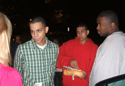Kevin Tavares, second from left, Stalin Felipe, center, and Rondell Bedward, right, talk to a reporter, left. Click image to expand.