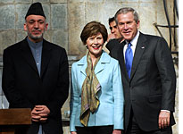 Afghan President Hamid Karzai, first lady Laura Bush, and U.S. President George W. Bush. Click image to expand.