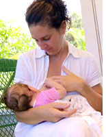 A mother breast-feeds her baby
Click image to expand.