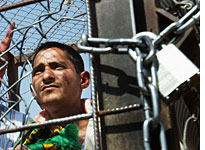 Prisoner at Abu Ghraib. Click image to expand.