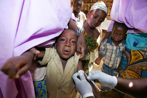 Nigerian children receiving a vaccine for meningitis.
