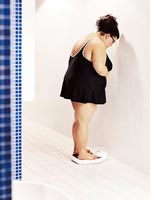 Woman standing on scales. Click image to expand.
