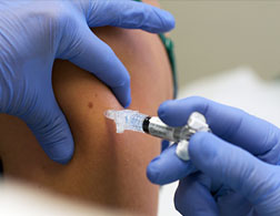 A patient receives the H1N1 vaccine. Click image to expand.