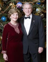 Laura and George Bush in front of the White House Christmas tree