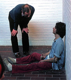 Duane Hanson's 1974 sculpture Drug Addict, observed by a museum guest