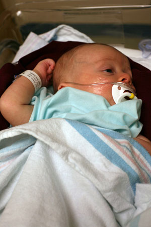 Walker with oxygen tubes.