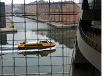 Ferries ply the inner harbor outside the Black Diamond