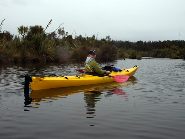 Kristin paddles on the Okarito Lagoon.