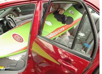 Kristin puts her equipment in the car
Click image to expand.