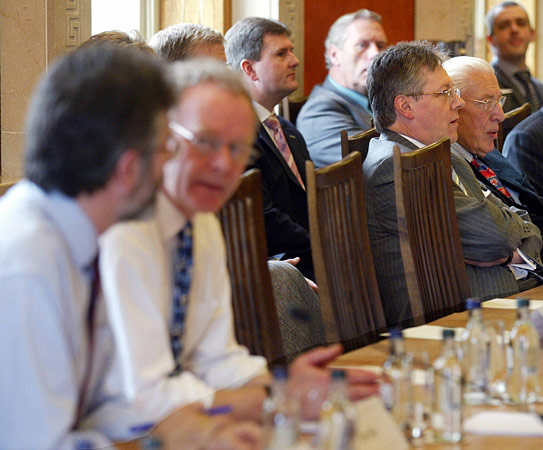 Gerry Adams (far left) and Ian Paisley (far right).