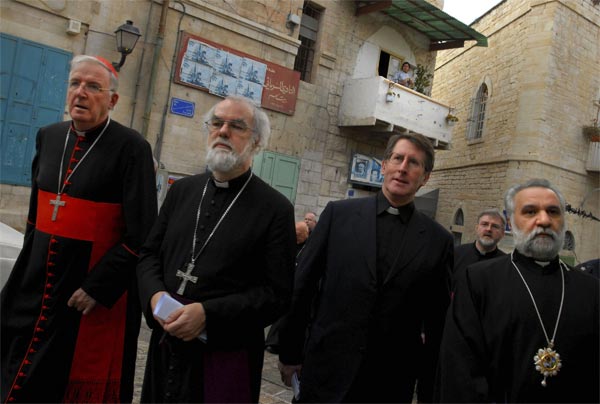 The archbishop of Canterbury with the Rev. David Coffey (center).