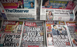 Copies of the last-ever News of The World newspaper are for sale at a newsagents in central Manchester. Click image to expand.
