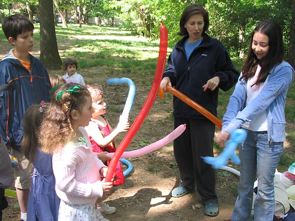 Making balloon animals.
