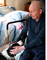 Izzy with a patient. Click image to expand.