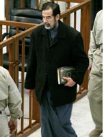 Saddam Hussein in caftan
Click image to expand.