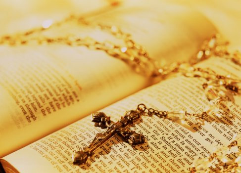 Rosary beads and bible.