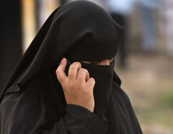 A woman wearing a burqa. 